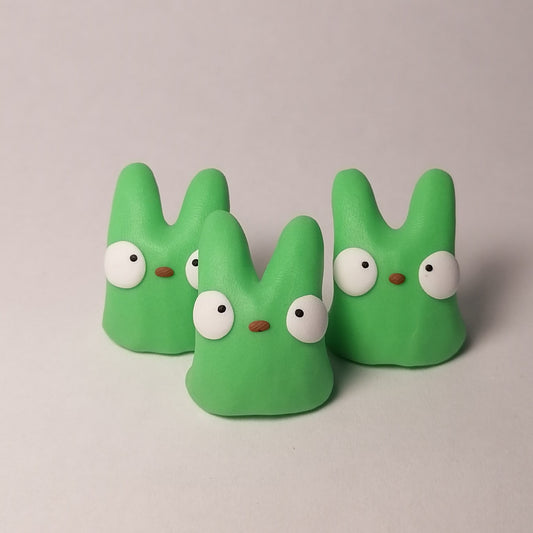 Neon vihreän väriset Onni hahmot