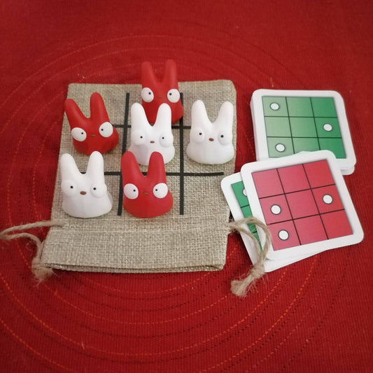 Onni-peli kangaspussilla - valkoiset ja punaiset hahmot